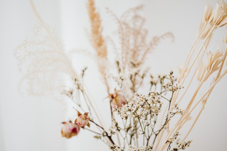 An arrangement of dried sedum and assorted flowers creating a captivating display