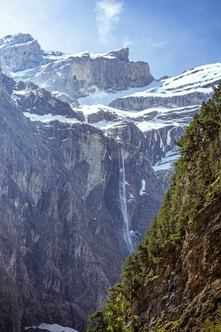 Impressive mountain slopes illustrate how sedimentary rocks become igneous rocks