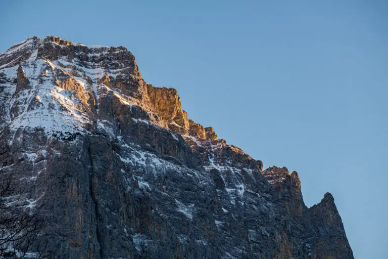 Sedimentary rock layers forming on a mountain peak