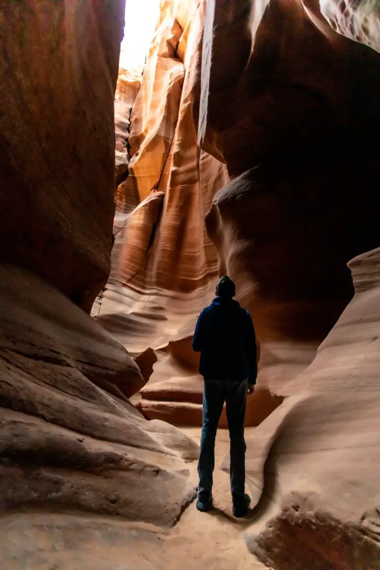 how do sedimentary rocks differ from igneous rocks - Man Standing in Antelope Canyon