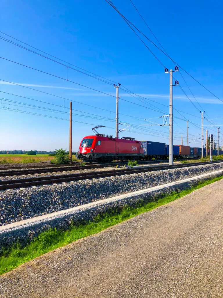 how do sediments form - Red and White Train on Rail Tracks Under Blue Sky